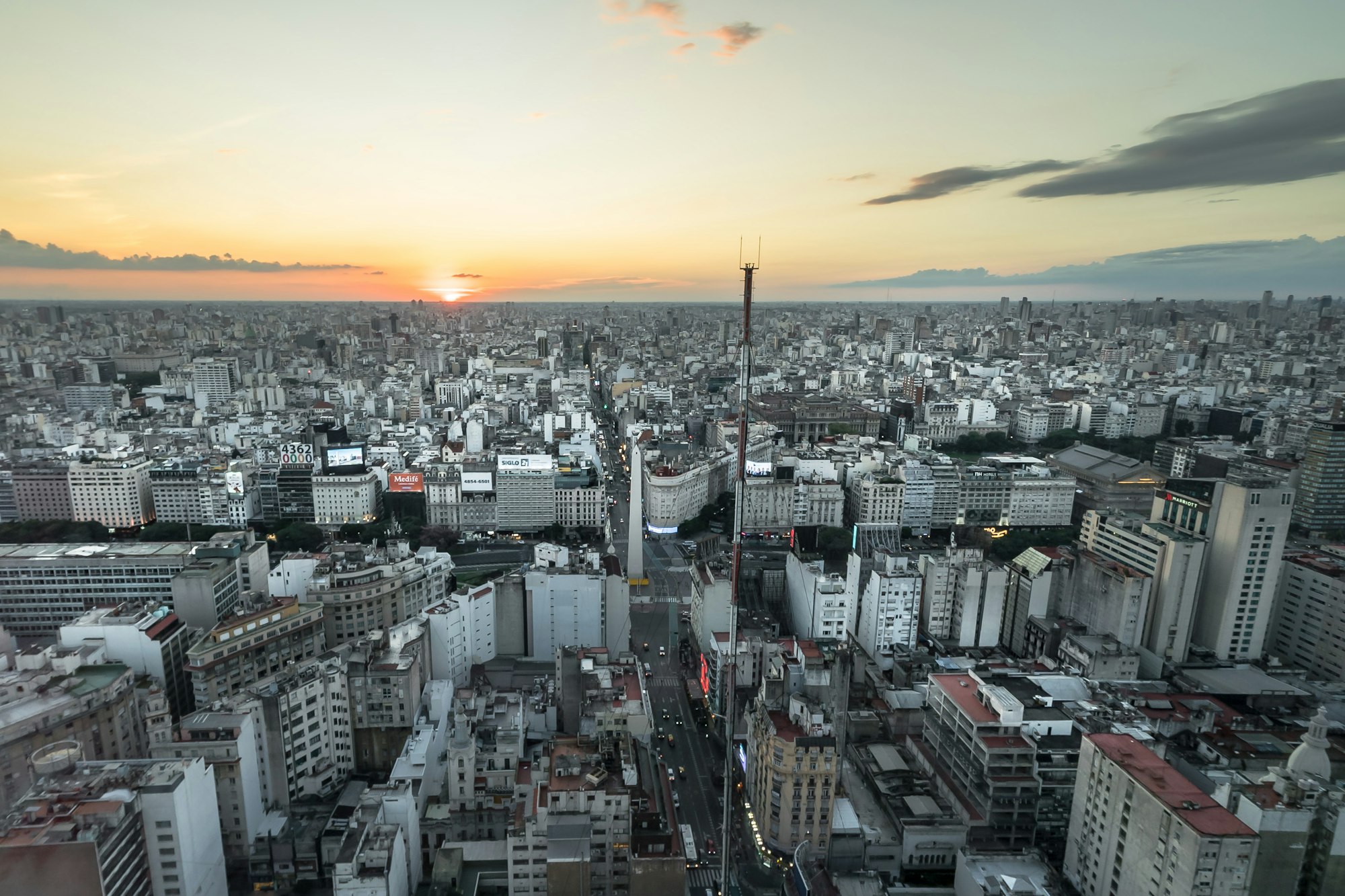 Aerial view of an Argentine city with high-rise buildings at sunset