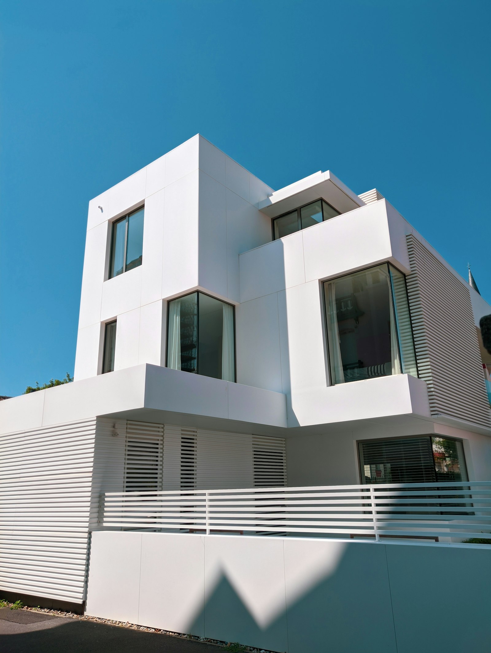 White concrete building of modern architecture under a clear sky